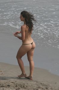 Topless girl goes full-nudist at textile beach  Almeria (Spain)-w6w4xsvdrc.jpg