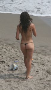 Topless girl goes full-nudist at textile beach  Almeria (Spain)-k6w4xsxr6a.jpg