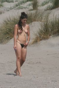 Topless girl goes full-nudist at textile beach  Almeria (Spain)-i6w4xt4pk3.jpg