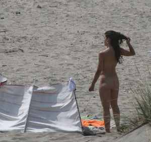 Topless girl goes full-nudist at textile beach  Almeria (Spain)-u6w4xtv5yk.jpg