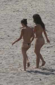 Topless girl goes full-nudist at textile beach  Almeria (Spain)-b6w4xua5p4.jpg
