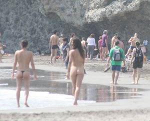 Topless-girl-goes-full-nudist-at-textile-beach-Almeria-%28Spain%29-x6w4xuitwj.jpg