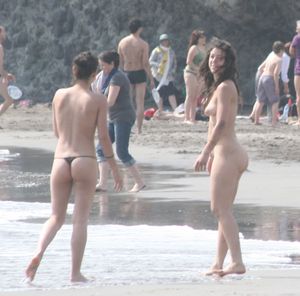 Topless girl goes full-nudist at textile beach  Almeria (Spain)-e6w4xu0234.jpg