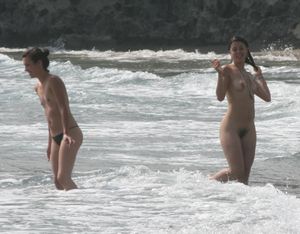 Topless girl goes full-nudist at textile beach  Almeria (Spain)-q6w4xu47vu.jpg