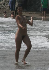 Topless girl goes full-nudist at textile beach  Almeria (Spain)-d6w4xu6be6.jpg