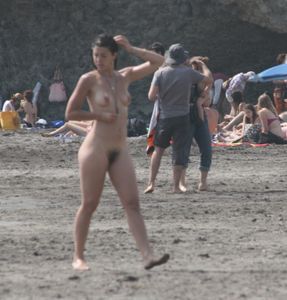 Topless girl goes full-nudist at textile beach  Almeria (Spain)-o6w4xu7yqo.jpg