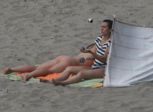Topless girl goes full-nudist at textile beach  Almeria (Spain)-h6w4xukhjp.jpg