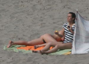 Topless girl goes full-nudist at textile beach  Almeria (Spain)-06w4xulwss.jpg