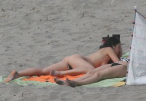 Topless girl goes full-nudist at textile beach  Almeria (Spain)e6w4xun3u5.jpg