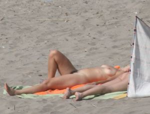Topless girl goes full-nudist at textile beach  Almeria (Spain)-m6w4xup6jm.jpg