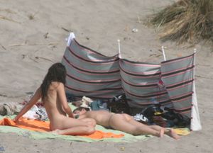 Topless girl goes full-nudist at textile beach  Almeria (Spain)-j6w4xuqq5o.jpg
