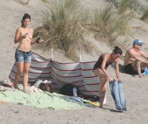 Topless-girl-goes-full-nudist-at-textile-beach-Almeria-%28Spain%29-x6w4xurse6.jpg